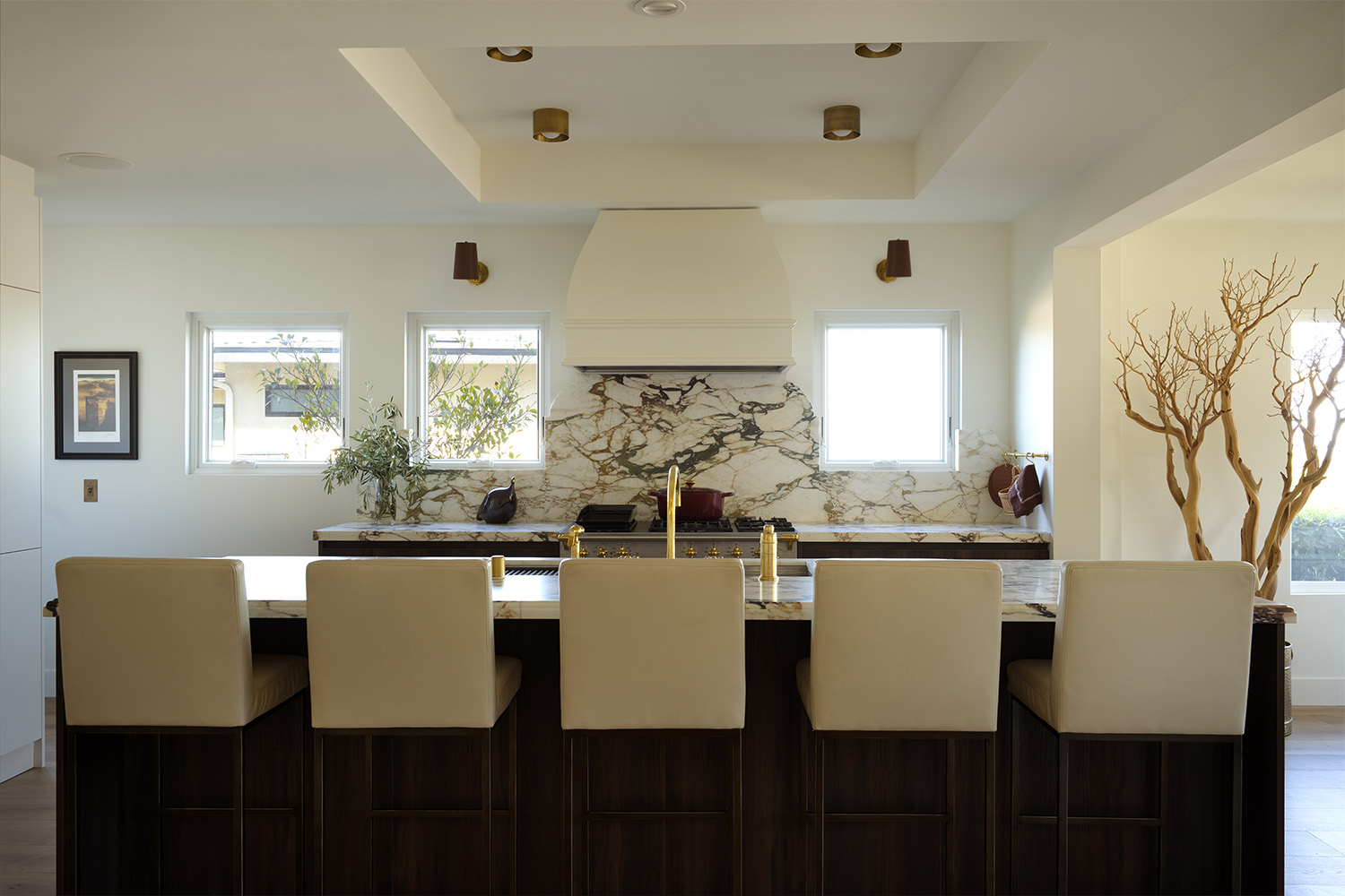 Expanded dining and kitchen area with open floor plan and natural light