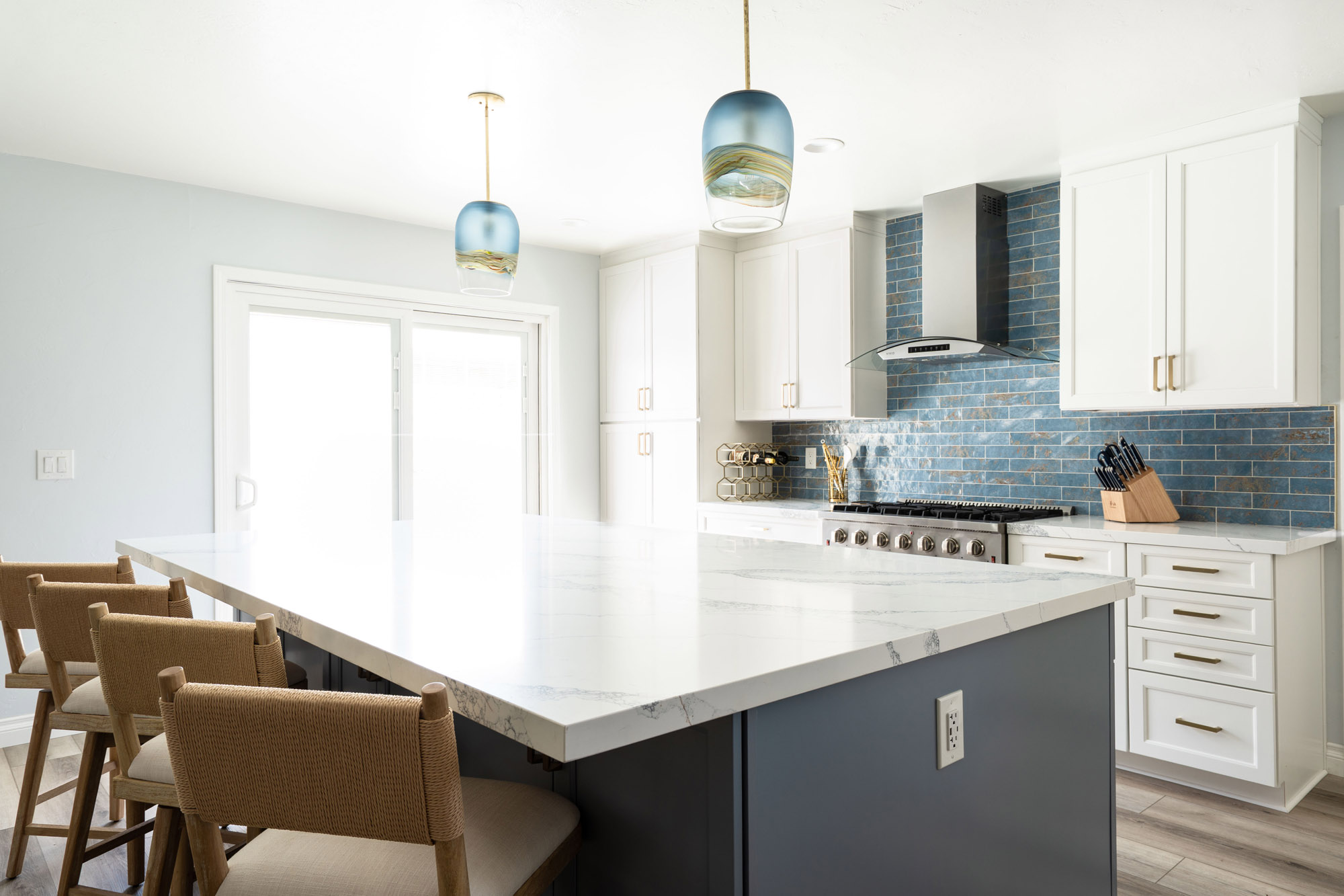 San Diego Kitchen Remodel, blue-coastal Load-bearing wall removal created space for this oversized quartz kitchen island in our coastal-inspired Clairemont, San Diego remodel.
