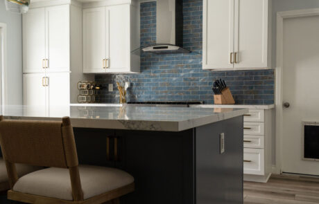 San Diego Kitchen Remodel, blue-coastal Coastal-style kitchen transformation in Clairemont, San Diego, featuring a spacious quartz island, charcoal cabinets, and blue tile.